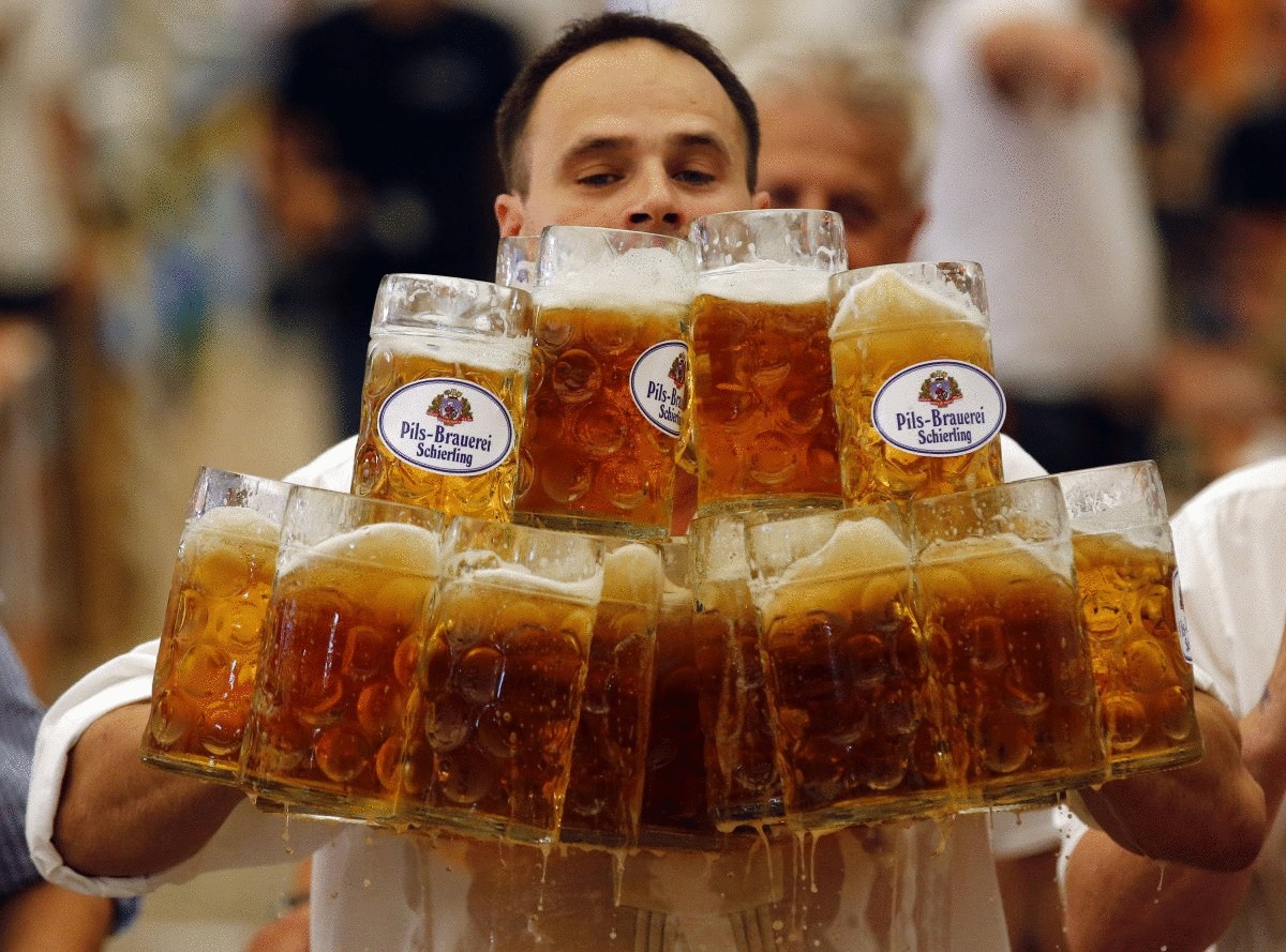 german-oliver-stuempfl-competes-to-set-a-new-world-record-for-carrying-one-liter-beer-mugs-over-a-distance-of-131-feet-on-sept-7-struempfl-carried-27-mugs-to-set-a-new-world-record