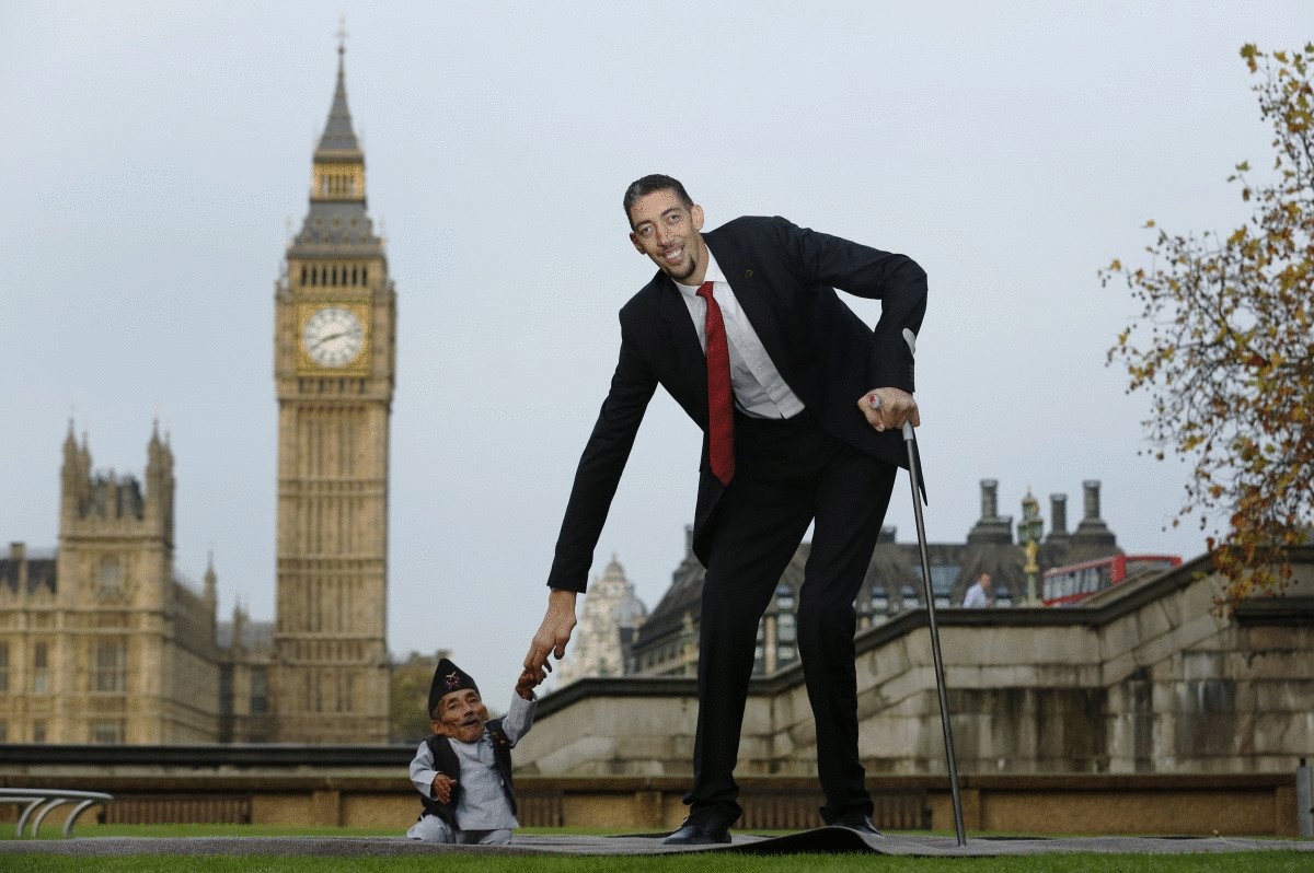 the-worlds-shortest-man-chandra-bahadur-dangi-greets-the-tallest-living-man-sultan-kosen-to-mark-the-guinness-world-records-day-in-london-nov-13-2014-kosen-measuring-more-than-8-feet-tall-towers-over-dangi-who-is-only-18